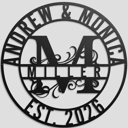 Personalized Monogram Family Name custom metal sign in matte black finish featuring a central initial, couple names, and established year, mounted straight-on against a neutral gray studio wall.
